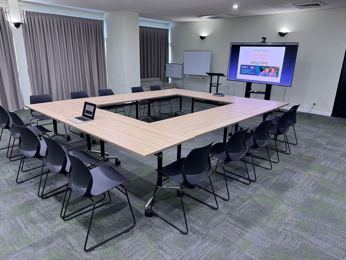 Hollow square meeting setup at Katherine Motel with presentation screen